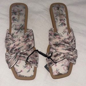 Express floral twist strap flat sandals.